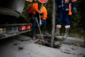 depositphotos 411564768 stock photo cleaning storm drains debris clogged